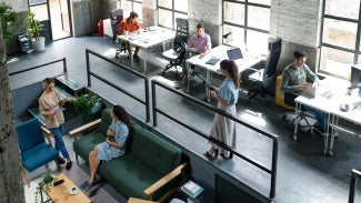 Wide Angle View of a Modern Loft Open Space Office With Businesspeople