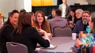 AIA members networking around a table