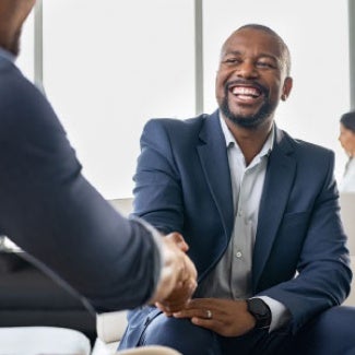 Two men shaking hands after an agreement