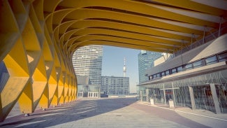 The Austria Center Vienna (ACV) - here the entrance - is Austria's largest convention center and is also one of Europe's most modern. It is used for conferences, exhibitions, corporate events and concerts. Skyscrapers in the background of the Danube and Danube tower can be seen.