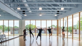 Students rehearse in space that imbues natural light from all sides.