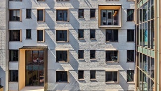 Courtyard East wall, from West, with pop-out study rooms.