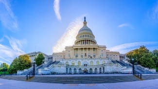 The west side of the US Capitol Building, with its grand neoclassical architecture, is a majestic sight before the influx of tourists. Located in Washington, D.C., the Capitol Building is the seat of the United States Congress and a symbol of the American government. High-resolution panorama image. Washington DC, USA.