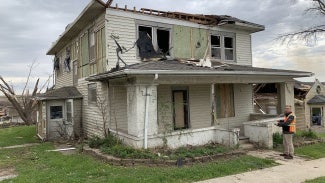 Iowa architect assessing a tornado-damaged home