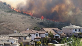 california wildfires above residential street