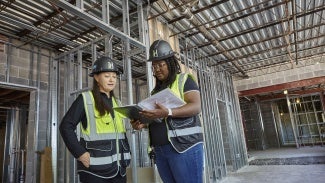 Architect and student on a job site