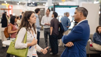 Mentee talking to their mentor at AIA conference