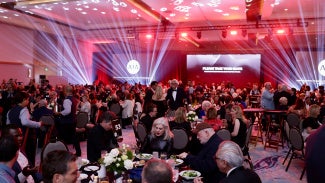 A room full people celebrating the 2026 AIA Award recipients.