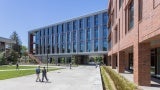 The building design thoughtfully responds to its prominent site at the intersection of the two major pedestrian routes across campus. The building’s two wings intersect at an angle, becoming a literal intersection of the campus community.