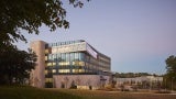 The building integrates multiple functions—orthopedics and spine care, physical therapy, imaging, and ambulatory surgery as well as clinical and research space—in a navigable and flexible space.