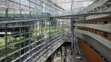 Bridges span the Glass Hall at upper levels connecting meeting rooms and events halls and provide structural bracing for the Glass Hall.