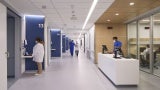 Inpatient corridor, featuring "sawtooth" wayfinding and charting alcoves.