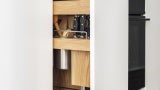 Pull-out storage in New York studio apartment.