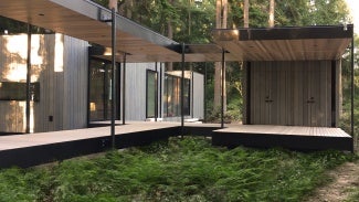 To sit lightly on the land, wood deck bridges connect different modules under a protective cedar soffit