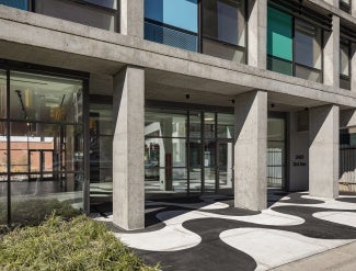 Entrance with concrete sidewalk pattern derived from Rio de Janeiro