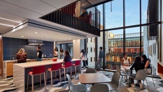 Double-height student lounge space on North side.
