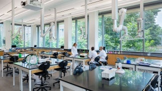 A transparent biology teaching lab serves as a departmental identity space to showcase the science within and integrate Singer Hall into the campus experience