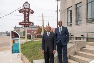 jimmie tucker aia juan self faia in front of office building