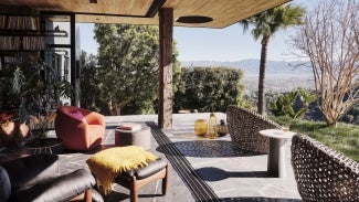 Patio looking out at fields and a mountain range