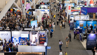 image of conference floor filled with attendees at the architecture expo