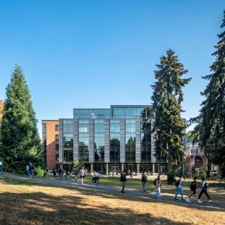 Exterior of Founders Hall, Foster School of Business on a sunny day.