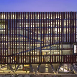 Exterior of Health Sciences Innovation Building at sunset