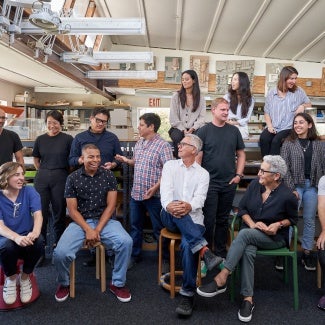 Group photo of the firm employees at their office