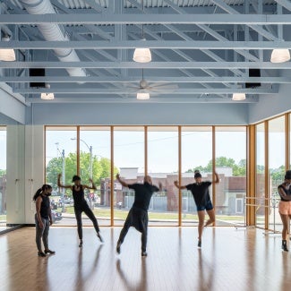 Students rehearse in space that imbues natural light from all sides.