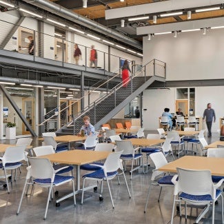 The building establishes several social gathering points along a circular circulation corridor, in addition to the science and engineering program areas