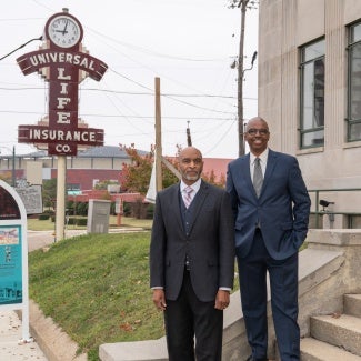 jimmie tucker aia juan self faia in front of office building