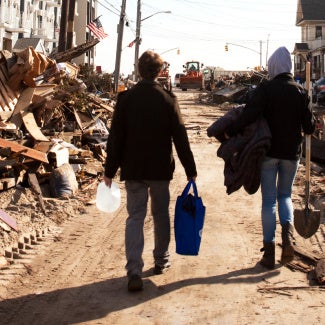image of community members surveying damage after a storm