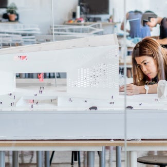 A person works on a model